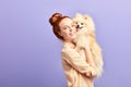 Pleasant girl embracing the pet Royalty Free Stock Photo