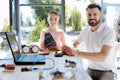 Pleasant girl having robotics workshop with her teacher