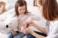 Pleasant little girl taking pills Royalty Free Stock Photo