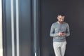 Pleasant man is typing message on mobile phone Royalty Free Stock Photo