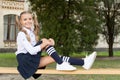 Pleasant minutes of rest. Relaxing in school yard. Perfect schoolgirl relaxing between classes. Life balance. Student