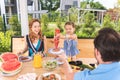 Pleasant nice girl putting ketchup on the meat