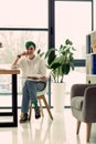 Pleasant nice woman sitting in her office Royalty Free Stock Photo