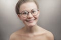 Pleasant woman wearing round glasses