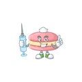 A pleasant nurse of strawberry macarons mascot design style using syringe