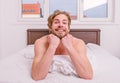 Pleasant relax concept. Let your body feel comfortable. Man unshaven handsome happy smiling torso relaxing bed. Guy sexy Royalty Free Stock Photo