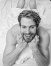 Pleasant relax concept. Let your body feel comfortable. Man unshaven handsome happy smiling torso relaxing bed. Man feel Royalty Free Stock Photo