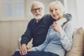 Pleasant senior man hugging his wife Royalty Free Stock Photo