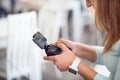 Pleasant senior woman holding game console