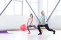 Pleasant slim women doing an exercise simultaneously Royalty Free Stock Photo