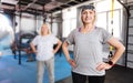 Pleasant sporty woman resting hands on her hips Royalty Free Stock Photo