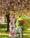 Pleasant spring day. blooming tree in spring time. natural female beauty. woman in garden. young fashionable girl with Royalty Free Stock Photo