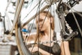 Pleasant technician repairing the bicycle in the garage Royalty Free Stock Photo