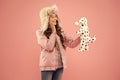 Pleasant Thoughts. Autumn Style. Childhood Happiness. Happy Kid Pink Background. Little Girl Dalmatian Dog Toy. Cold