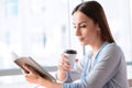 Pleasant woman drinking coffee