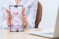 Pleasant woman holding sandglass