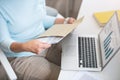 Pleasant woman opening envelope