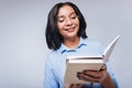 Pleasant woman reading notes in her notebook