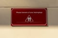Please beware of your belongings sign on wall Royalty Free Stock Photo