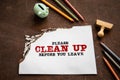Please clean up before you leave. Burning sheet of paper on a rusting metal background Royalty Free Stock Photo