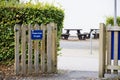 Please close gate sign on wooden fence at. children's play park Royalty Free Stock Photo