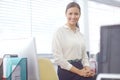 Please, come in...Portrait of an attractive young businesswoman working in her office. Royalty Free Stock Photo