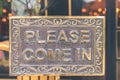 Please come in vintage sign in the store. Asia. Royalty Free Stock Photo