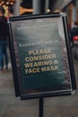 Please consider wearing a mask sign in Borough Market in London, UK, due to Coronavirus pandemic