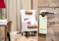 Do not disturb sign hanging on open door in a hotel Royalty Free Stock Photo