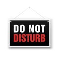 Please do not disturb, sign hanging on the white background.