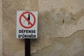 A please do not urinate sign in a small street in France