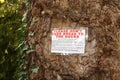 `Please don`t feed bread to the ducks` sign on a tree in the forest