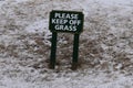 Please Keep Off Grass sign on snowy day, Cape Elizabth, Cumberland County, Maine, United States, New England US Royalty Free Stock Photo