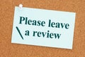 Please leave a review on card paper on a corkboard Royalty Free Stock Photo