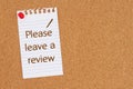 Please leave a review on ruled paper on a corkboard