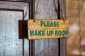 Please make up room sign on door knob in hotel