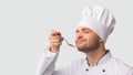 Pleased Chef Man Tasting Food Standing Over White Background, Panorama