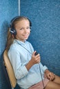 Female patient smiling at the camera during the hearing check