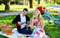 Pleased with each other. food and drink. man and woman. romantic couple on picnic. love in spring. summer outdoor
