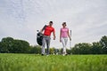 Pleased female golfer staring at her golf instructor Royalty Free Stock Photo