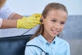 Pleased female patient undergoing an audiometry test Royalty Free Stock Photo