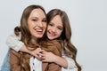 pleased girl embracing cheerful mother and Royalty Free Stock Photo