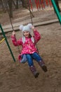 Pleased girl on a swing Royalty Free Stock Photo