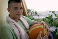 pleased and happy guy with a basketball