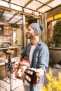 Pleased male guitarist improving his guitar skills