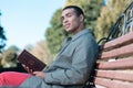 Pleased male person having break during walk Royalty Free Stock Photo