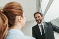 Pleased male speaking with girl during job