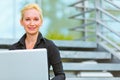 Pleased modern business woman using laptop Royalty Free Stock Photo