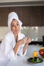 Pleased woman drinking morning coffee at home Royalty Free Stock Photo