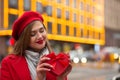 Pleased woman holding red box with a bow Royalty Free Stock Photo